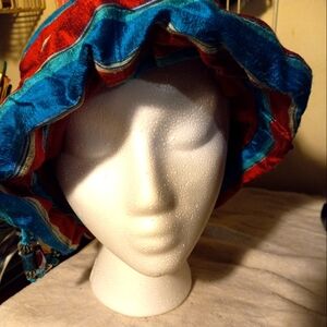 Not new, never worn  stripped silk dupponi teal&red floop hat with trim& beads.